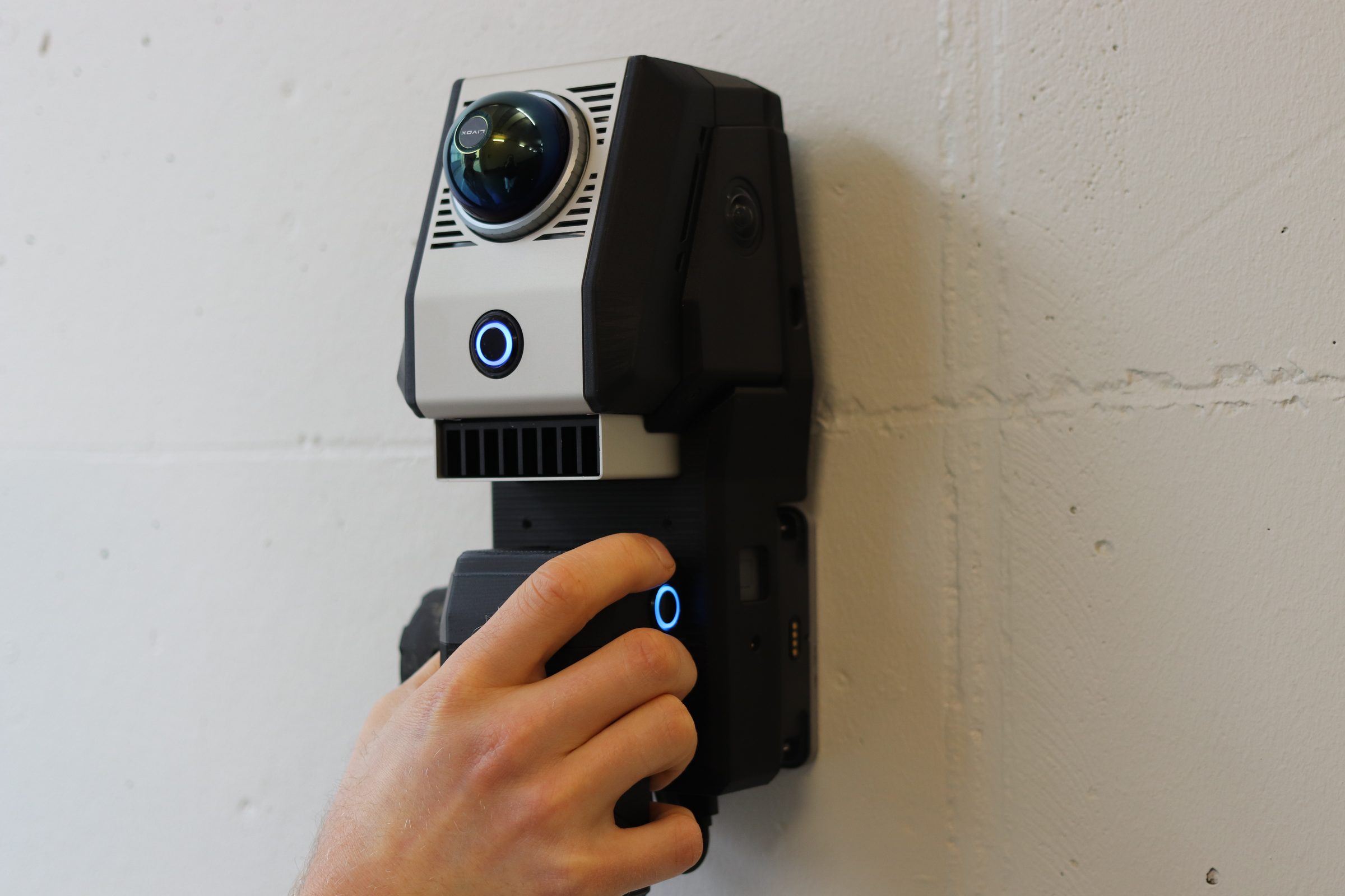 The Birdsview scanner held against a light wall